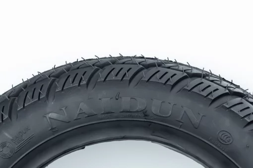 Шина 3,00-10 бескамерная, шипованная "ёлка" N128, ШИНИ, YQ-303102